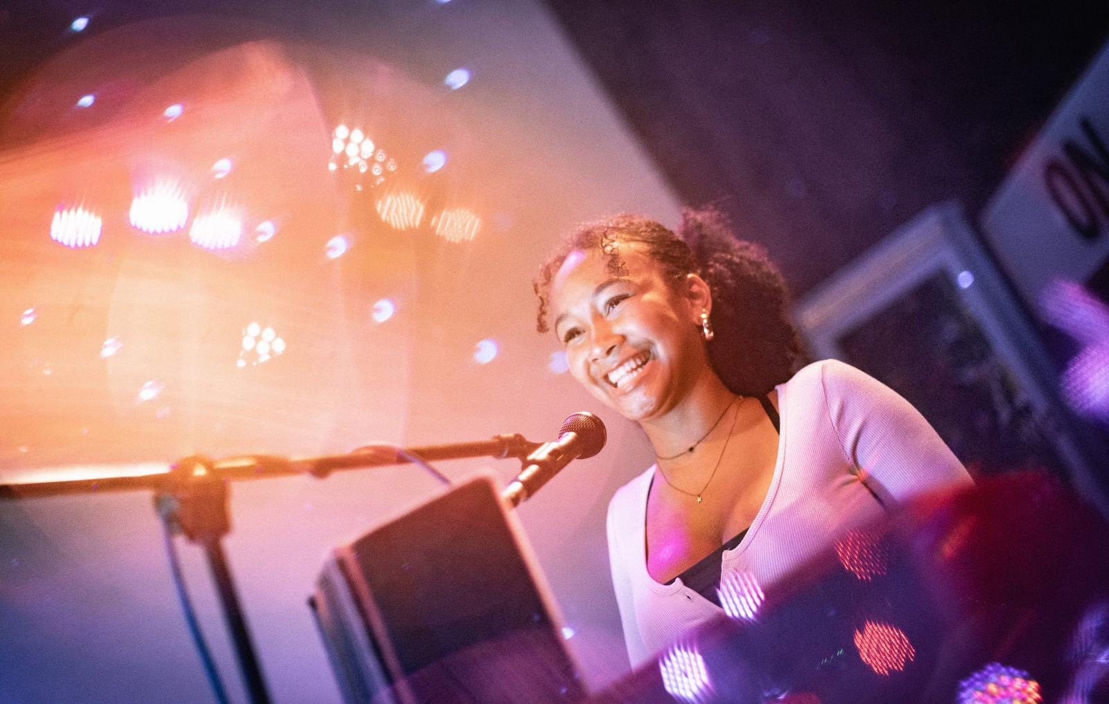 Jemima performing on stage